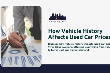 A person holding a marker points to a printed paper displaying graphs, illustrating how vehicle history affects used car prices.